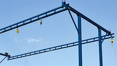 Gorbel tether track free standing overhead monorail lifeline fall protection system set up outside.