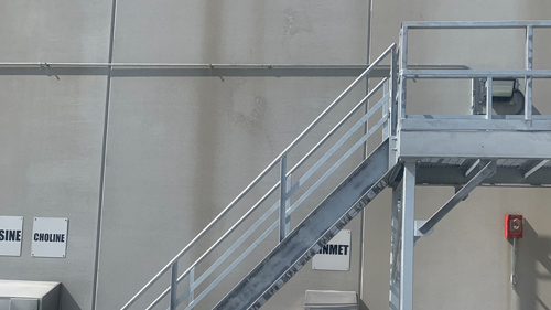 Truck access platform at a chemical facility for unloading materials from tank trucks.